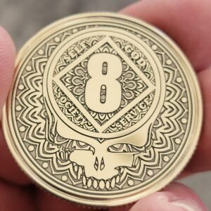 NA Stealie recovery anniversary coin with years on front and NA symbol on the back.